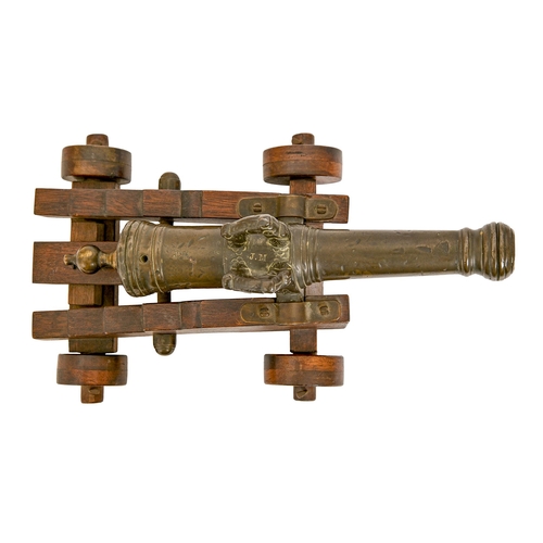 591 - A Dutch-style miniature bronze cannon, 19th c, of 15mm bore, the three stage barrel with bellied muz... 