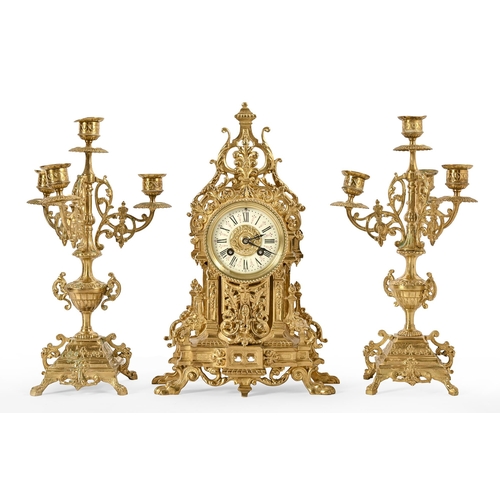 592 - A French pierced and lacquered brass garniture de cheminée, AD. Mougin, c1870, pearl striking moveme... 