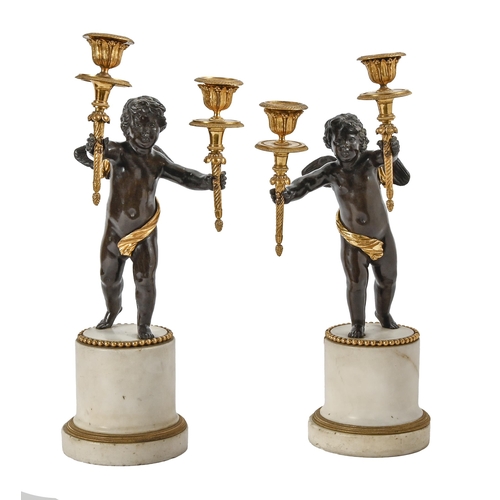 598 - A pair of French parcel gilt bronze Putto figural twin light candelabra, cast from models by Claude ... 