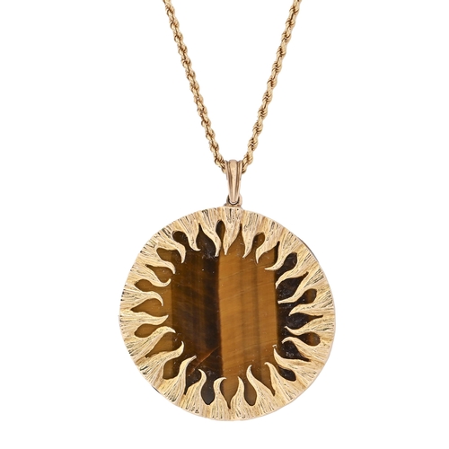 6 - A tiger's eye and 9ct gold pendant, 51mm diam, marks indistinct, 36.8g, an 18ct gold necklet, 10.3g... 