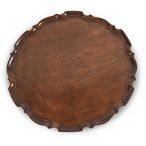 620 - A mahogany shaped circular tray, 19th c, moulded 'pie crust' edge, 42cm w