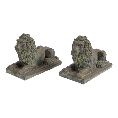 648 - A pair of bronze-painted terracotta lions, 39.5cm l (2)