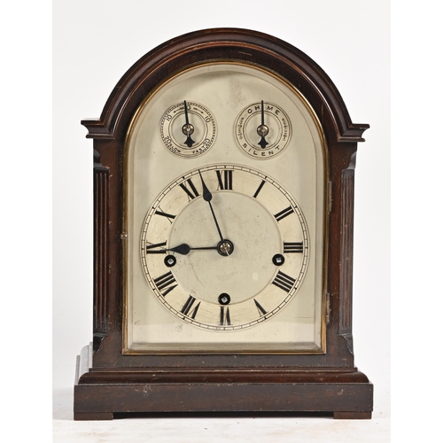 684 - A German mahogany clock, c1900, the arched, silvered dial with chapter ring and twin subsidiary ring... 