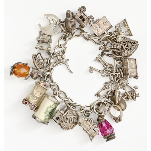 69 - A silver charm bracelet, 16cm l, 73g