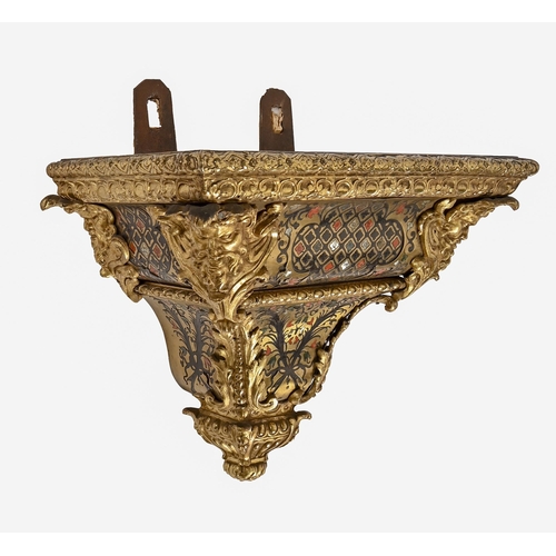 692 - A French Boulle clock bracket, 19th c, in Louis XV style, richly mounted with gilt brass masks and a... 