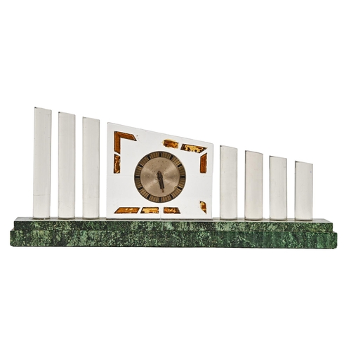 694 - A French art deco glass timepiece, c1930, the round encased movement set in a glass block, flanked b... 