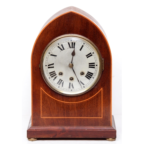 841 - An inlaid mahogany arched top mantle clock, early 20th c, with silvered dial and brass bun feet, pen... 