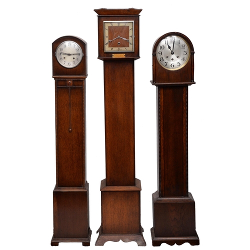 856 - An oak dwarf longcase clock, c1930, the square dial with silvered chapter ring, 133cm h and two cont... 