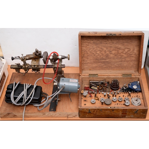 862 - A watchmaker's lathe, with Acadex motor, 38cm w, a quantity of collets tools and other attachments i... 