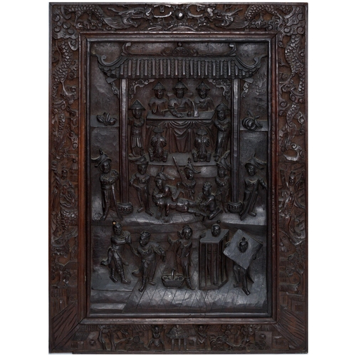 872 - A carved Chinese hardwood panel, decorated with scenes from a criminal court, 61 x 45cm... 