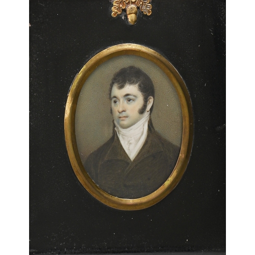 939 - English School, early 19th century - Portrait Miniature of a Young Man, in white stock and brown coa... 