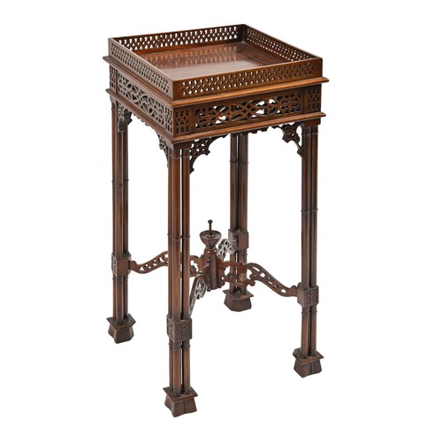 1106 - A mahogany fretwork urn stand, early 20th c, in George III style, with slide, on cluster column legs... 