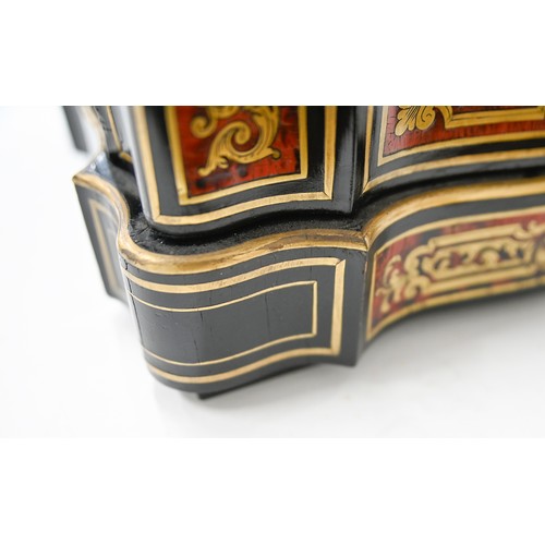 1098 - A French ebonised and Boulle decanter case, late 19th c, inlaid with cut brass scrollwork on a groun... 