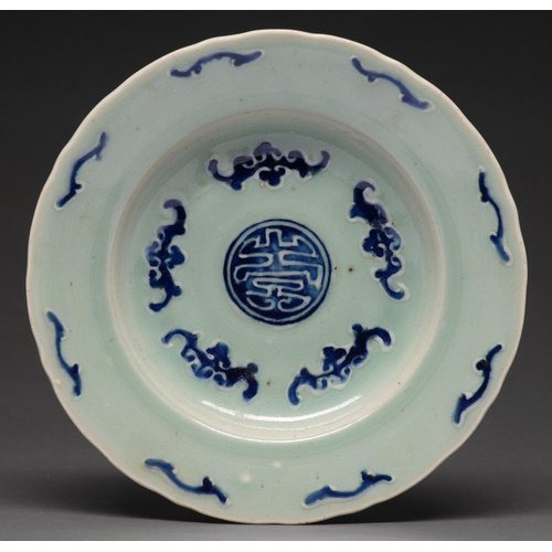 485 - A Chinese celadon ground blue and white 'Bats' dish for the South East Asian market, 19th c, 26cm di... 