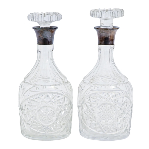 241 - Two matching Elizabeth II silver mounted cut glass decanters and stoppers, 25cm h, by Mappin & W... 