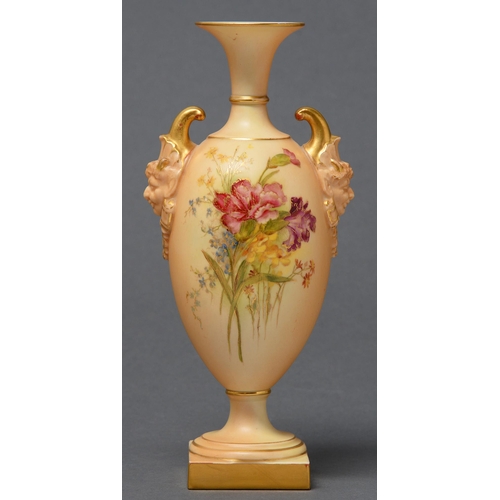 320 - A Royal Worcester vase, 1910, printed and painted with flowers on an ivory ground, with twin mask ha... 