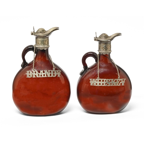 325 - Two Victorian EPNS mounted amber glass flagon decanters, c1870, 19.5 and 21.5cm h and a pair of cont... 