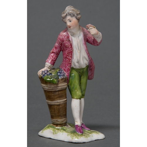 393 - A Niderviller faience figure of a vendangeur, c1780, in polychrome patterned puce coat and green bre... 