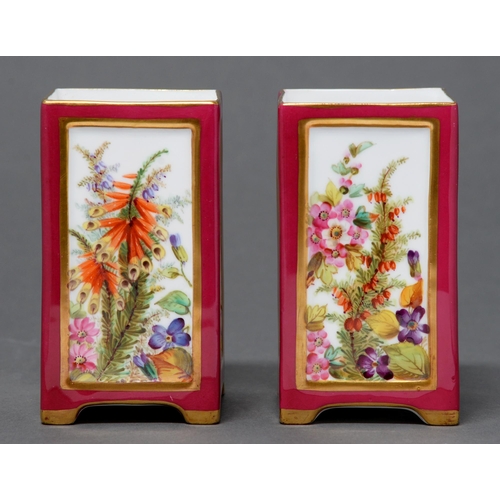 398 - A pair of Coalport square spill vases, c1880, painted to each sides with heaths reserved on a claret... 