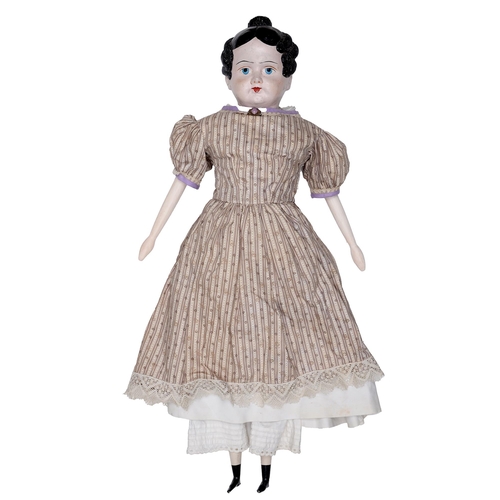 524 - A papier-mache shoulder head doll, c1840, with painted features and moulded hair, on a cloth body wi... 