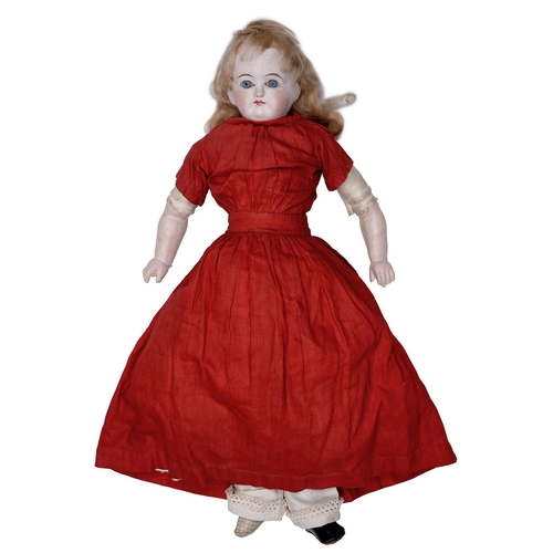 526 - A composition shoulder head doll, c1870, with fixed glass eyes and closed mouth, with original blond... 