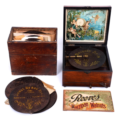 563 - A Douglas & Co polyphon and twenty-nine discs, late 19th c, in a walnut veneered case with bone ... 