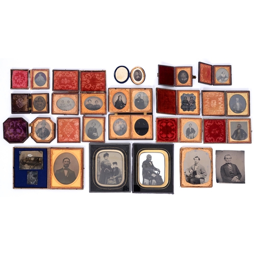 574 - Victorian photography. Twenty-one ambrotypes and two tin types of men, women and children, mid-19th ... 