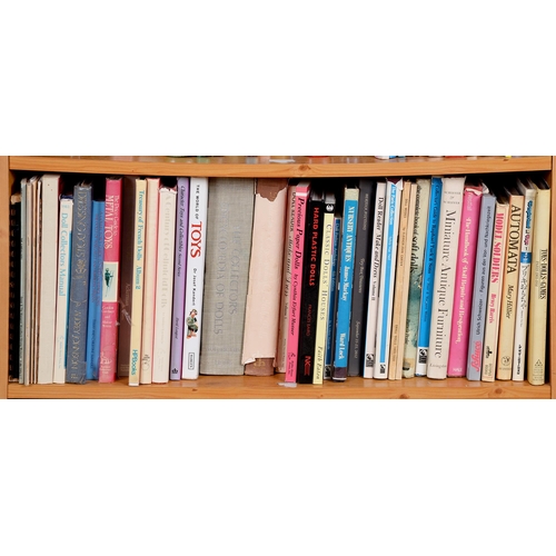 630 - Books. Five shelves of antique doll reference, 20th c, some further toys and juvenalia works, princi... 