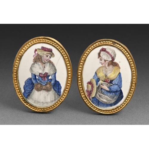 637 - A pair of George III gilt brass and enamel-inset curtain pins, printed and painted with a fashionabl... 