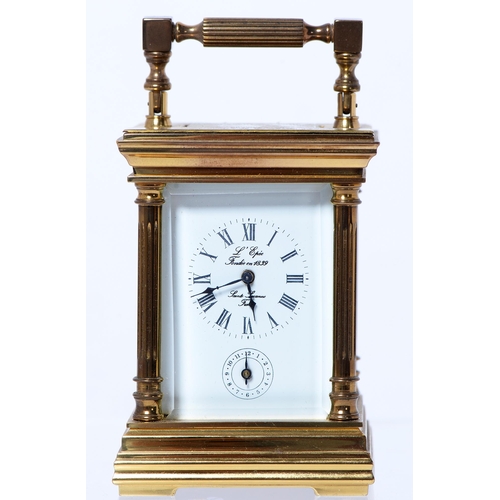 644 - A French brass miniature carriage timepiece, platform escapement behind bevelled glass, the movement... 