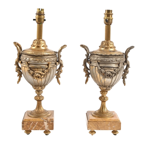 717 - A pair of French fin de siècle bronzed spelter vases, on Siena marble base, adapted as table lamps, ... 