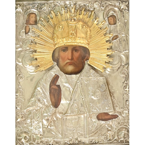 788 - Russian icon. St Nicholas, 19th c, with parcel gilt repousse riza, 21 x 17cm, beneath glass in conte... 