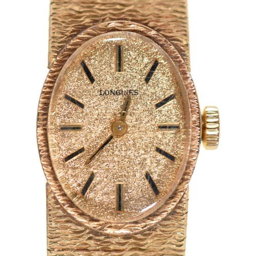 80 - A Longines 9ct gold oval lady's wristwatch, 20mm, import marked London 1970, on 9ct gold textured br... 