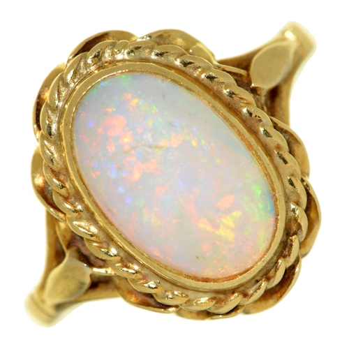 9 - An opal ring, in 18ct gold, London 1985, 4.6g, size M