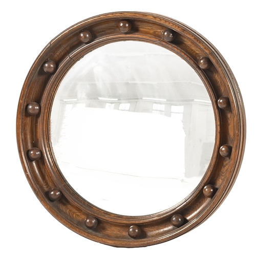 927 - A Victorian convex mirror, with oak frame, 45.5cm diam