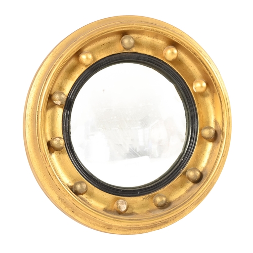 928 - A Victorian giltwood and composition convex mirror, 24cm diam