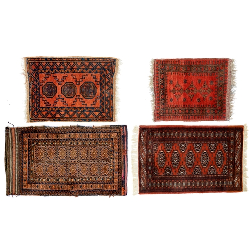 934 - A Middle Eastern sack or saddlebag, 114 x 65cm and three smaller rugs