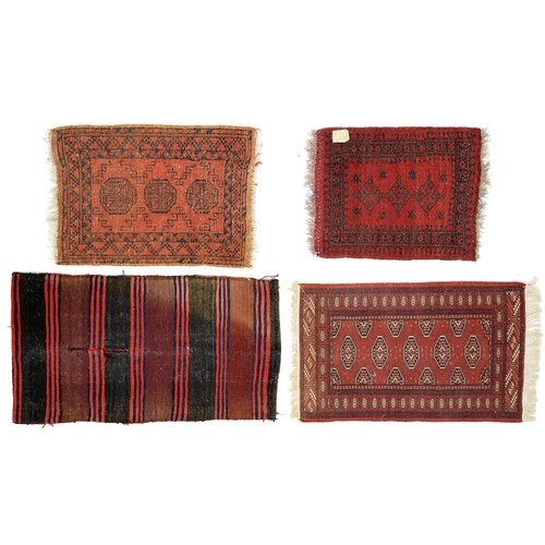 934 - A Middle Eastern sack or saddlebag, 114 x 65cm and three smaller rugs