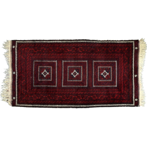 947 - A Middle Eastern runner and two rugs, 94 x 313cm, 105 x 165cm and 102 x 182cm