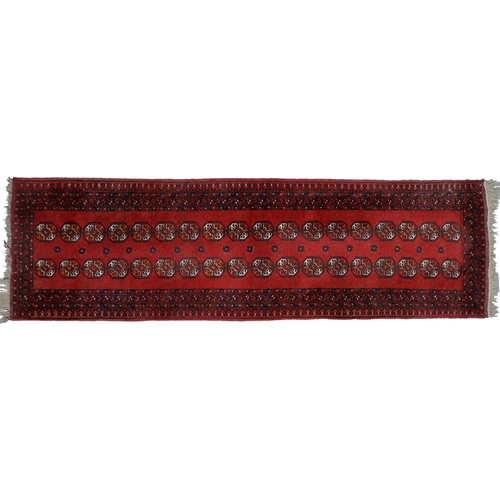 947 - A Middle Eastern runner and two rugs, 94 x 313cm, 105 x 165cm and 102 x 182cm