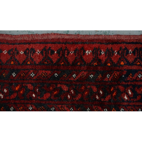 947 - A Middle Eastern runner and two rugs, 94 x 313cm, 105 x 165cm and 102 x 182cm