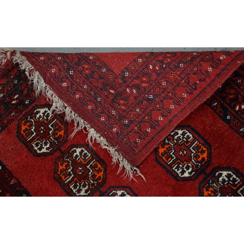 947 - A Middle Eastern runner and two rugs, 94 x 313cm, 105 x 165cm and 102 x 182cm