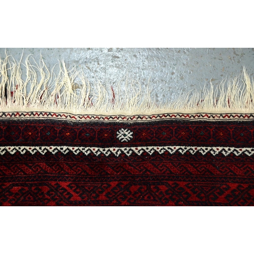 947 - A Middle Eastern runner and two rugs, 94 x 313cm, 105 x 165cm and 102 x 182cm