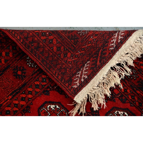 947 - A Middle Eastern runner and two rugs, 94 x 313cm, 105 x 165cm and 102 x 182cm