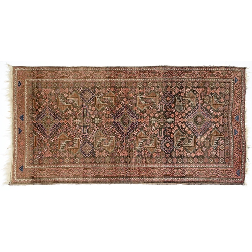 948 - A Middle Eastern rug, 202 x 105cm