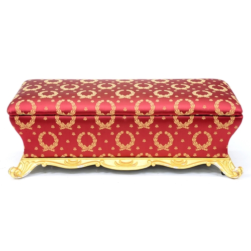 958 - A Victorian giltwood ottoman, recovered in Napoleonic style claret and gold wreath and bee fabric, o... 