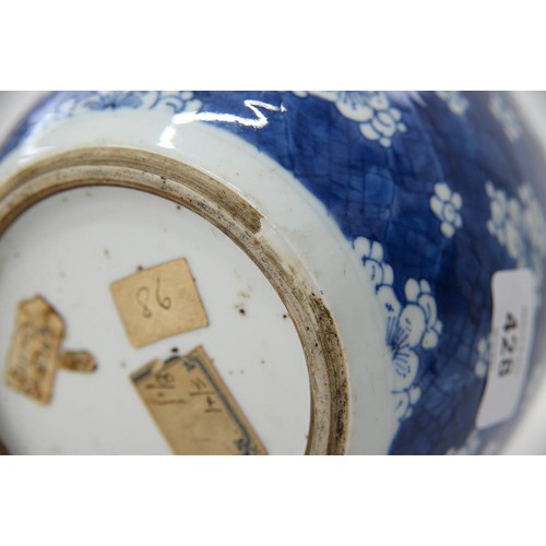 428 - A Chinese blue and white ginger jar, Kangxi, painted with prunus on a cracked ice ground, 17cm h, wo... 