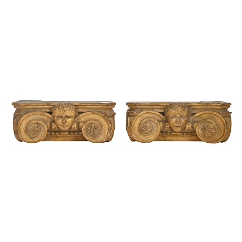 244 - A pair of English Baroque style gilt and limewood capitals, 19th c, in the manner of William Kent, c... 