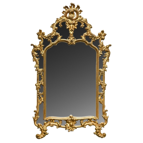 595 - A reproduction rococo gilt mirror, 139cm h