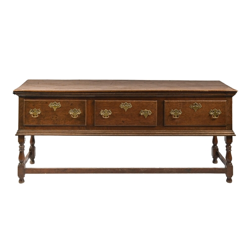 618 - An oak dresser, early 20th c, the two-plank top with moulded cornice above three moulded drawers, on... 